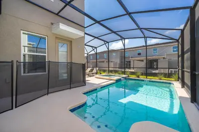 a swimming pool in a building with a glass ceiling at 4338JE VILLA 5 BED/5 BA in Kissimmee