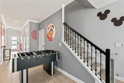 a staircase in a home with a display of shoes at Lakeview 5BR with Game Room and Pool, Near Disney in Kissimmee