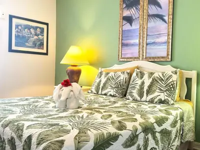 a bedroom with a bed with a stuffed animal on it at 10 Min from Disney Themed 2 Bd Private Pool in Orlando