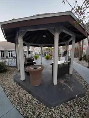 a gazebo with a bench under it at Nice 2 Miles from DISNEY Condo 1 Bedroom 1 Bath in Orlando