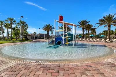 a water park with a slide in the water at Luxury 6 Bedroom 5 bath poolHome 214 in Orlando