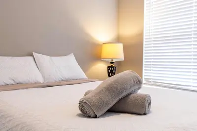 a bedroom with a bed with a pillow on it at Cozy Family 3BR Townhouse Perfect Stay for 6 Guests in Kissimmee