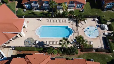 an overhead view of a swimming pool at a resort at Cozy Family 3BR Townhouse Perfect Stay for 6 Guests in Kissimmee