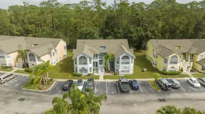 an aerial view of a house with a parking lot at Family Apt very close to Disney in Kissimmee