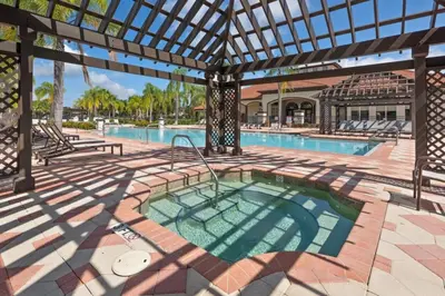 a swimming pool with an outdoor patio with a swimming pool at Luxury 4 bedroom 3 bath pool Home 283 in Kissimmee