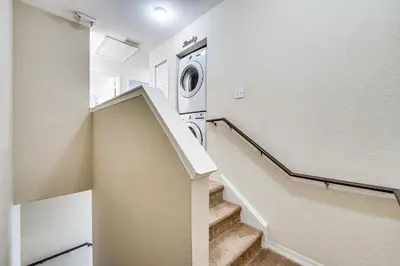 a laundry room with a washer and dryer at 14 Mi to Disney World Kissimmee Condo with Perks! in Kissimmee