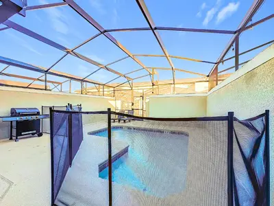 a indoor swimming pool with a roof at Incredible Family Retreat with PS5 Private Pool and access to 2 Clubhouses in Kissimmee