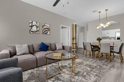 a living room with a couch and a table at 2306 SP - Disney Paradise 2BR Villa, Near Magic & More in Kissimmee
