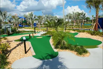 a golf course at a resort with a putting green at 4BR Villa Private Pool - 11 Guests - Ultimate Family Adventure Awaits in Kissimmee