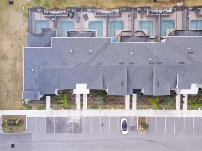 an aerial view of a building with a roof at 2901 SS Discover Opulence 4-Bedroom Villa with Pool, and Magical Themed Rooms! in Kissimmee