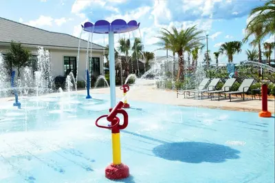 a pool with a water fountain with a pair of scissors at 2901 SS Discover Opulence 4-Bedroom Villa with Pool, and Magical Themed Rooms! in Kissimmee