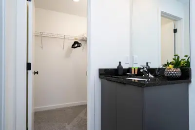a bathroom with a sink and a mirror at Luxury 3 Bed Home up to 8 guests- The Hub - 3236 TT in Orlando