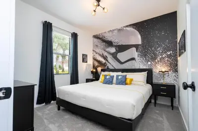 a bedroom with a bed and a large window at Luxury 3 Bed Home up to 8 guests- The Hub - 3236 TT in Orlando