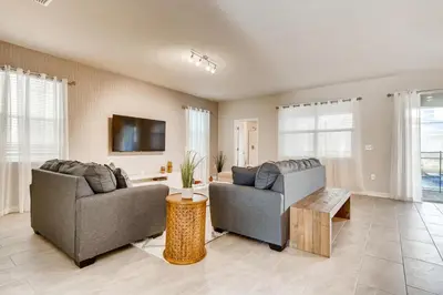 a living room with two couches and a tv at Stunning 6BR Home, Private Pool & Spa - 14 Guests - 4507 NL in Kissimmee