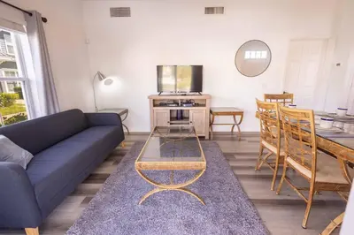 a living room with a couch and a table at 4562 YR Amazing in Kissimmee