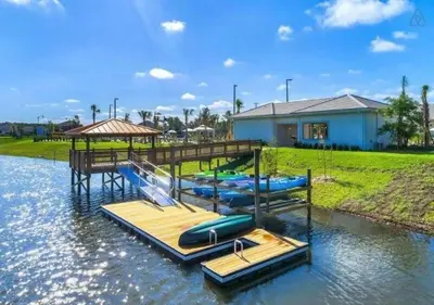 a group of inflatables on a dock in the water at In-Home Arcade, Themed Bedrooms, Resort Lazy River in Kissimmee