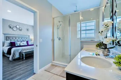 a bathroom with a sink and a shower and a bed at Resort Home near Disney Themed Jacuzzi Pool 2609 in Orlando