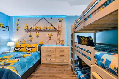 a bedroom with two twin beds and a bunk bed at Resort Home near Disney Themed Jacuzzi Pool 2609 in Orlando