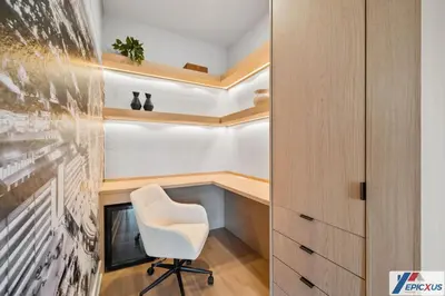 a home office with a white chair in a room at The epic Orlando Vista Cay in Orlando