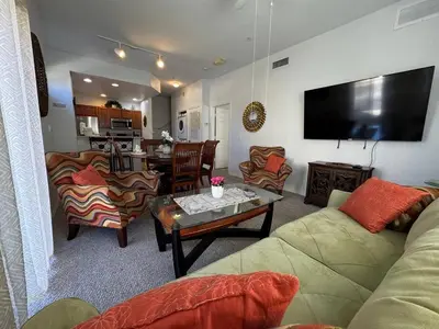 a living room with a couch and a table at 4 Bedroom 3 Bathroom Villas At SevenDwarfs 28-107 in Kissimmee