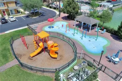 an aerial view of a playground in a park at 3 Bedroom 2 Bathroom Villas At SevenDwarfs 19-106 in Kissimmee