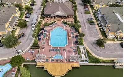 an aerial view of a house with a swimming pool at 3 Bedroom 2 Bathroom Villas At SevenDwarfs 15-103 in Kissimmee