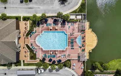 an overhead view of a swimming pool with a resort at 3 Bedroom 2 Bathroom Villas At SevenDwarfs 15-103 in Kissimmee
