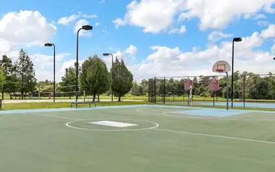 a basketball court with a basketball hoop at 3 Bedroom 2 Bathroom Villas At SevenDwarfs 15-103 in Kissimmee