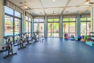 a gym with treadmills and exercise bikes at Chic 1-Bedroom Apt in Lake Nona in Orlando