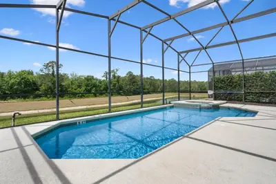 an overhead view of a swimming pool in a building at La Isla Retreat - amazing 6 bedroom pool house near Disney Parks in Kissimmee