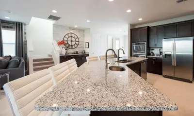 a kitchen with a large island with a counter top at Ultimate 5 Star Villa with Private Pool on Encore Resort at Reunion Orlando Villa 4391 in Orlando
