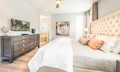 a bedroom with a large bed and a dresser at Ultimate 5 Star Villa with Private Pool on Encore Resort at Reunion Orlando Villa 4391 in Orlando
