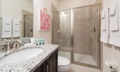 a bathroom with a shower and a sink and a toilet at Ultimate 5 Star Villa with Private Pool on Encore Resort at Reunion Orlando Villa 4391 in Orlando