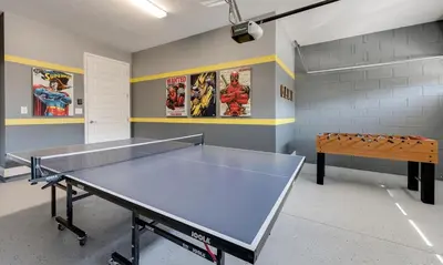 a ping pong table in a room with a bench at Luxury Private Villa with Large Pool on Encore Resort at Reunion Orlando Villa 4433 in Orlando