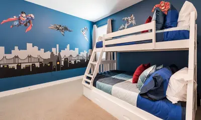 a bedroom with two bunk beds with superhero wall decals at Luxury Private Villa with Large Pool on Encore Resort at Reunion Orlando Villa 4433 in Orlando