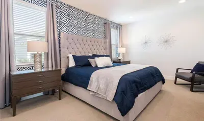 a bedroom with a large bed and a window at Luxury Private Villa with Large Pool on Encore Resort at Reunion Orlando Villa 4433 in Orlando