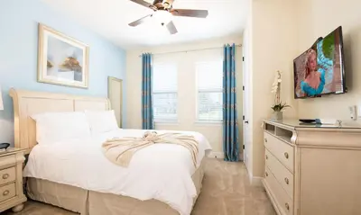 a bedroom with a bed and a ceiling fan at 5 Star Villa on Orlando’s most Exclusive Encore Resort at Reunion Orlando Villa 4355 in Orlando
