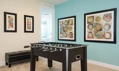 a large game room with a large game table at 5 Star Villa on Orlando’s most Exclusive Encore Resort at Reunion Orlando Villa 4355 in Orlando