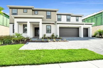 a large house with a garage at Amazing Mansion on Veranda Palms Resort with the Best 5 Star Amenities Orlando Mansion 5533 in Kissimmee