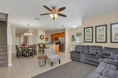 a living room with a couch and a ceiling fan at Luxury 5 Star Villa on Paradise Palms ResortMinutes from Disney World Orlando Townhome 5502 in Kissimmee