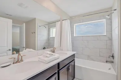 a bathroom with a sink and a tub and a shower at Imagine You and Your Family Renting this 5 Star Villa on Storey Lake Resort Orlando Townhome 5519 in Kissimmee
