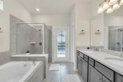 a white bathroom with two sinks and a tub at Elegant Villa for Large Groups 6281 in Kissimmee