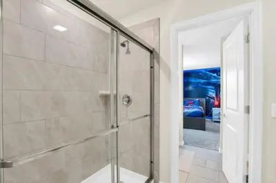 a glass shower stall in a bathroom with at Elegant Villa for Large Groups 6281 in Kissimmee