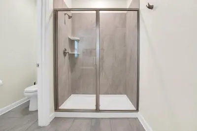 a shower with a glass door in a bathroom at Escape to a 5 Bedroom Villa in Paradise 6316 in Kissimmee