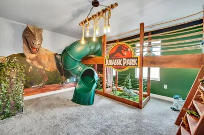a childs play area with a dinosaur playground at Family-Friendly Villa with 9 Bedrooms 6317 in Kissimmee