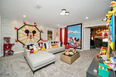 a living room filled with lots of toys at Family-Friendly Villa with 9 Bedrooms 6317 in Kissimmee