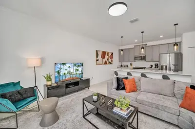 a living room with a couch and a table at Cozy 4 Bedroom Urban Oasis 6326 in Kissimmee