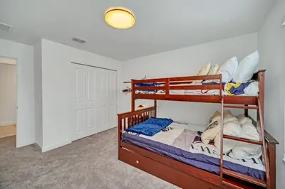 a bedroom with two bunk beds in a room at Cozy 4 Bedroom Urban Oasis 6326 in Kissimmee