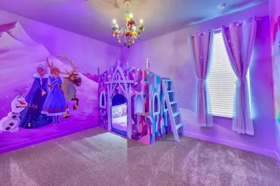 a purple bedroom with arozen bed and a castle at Elegant Villa Retreat with Private Pool 6328 in Kissimmee