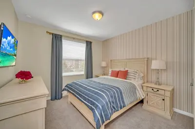 a bedroom with a bed and a window at Chic Urban Oasis with 3 Bedrooms 6333 in Kissimmee